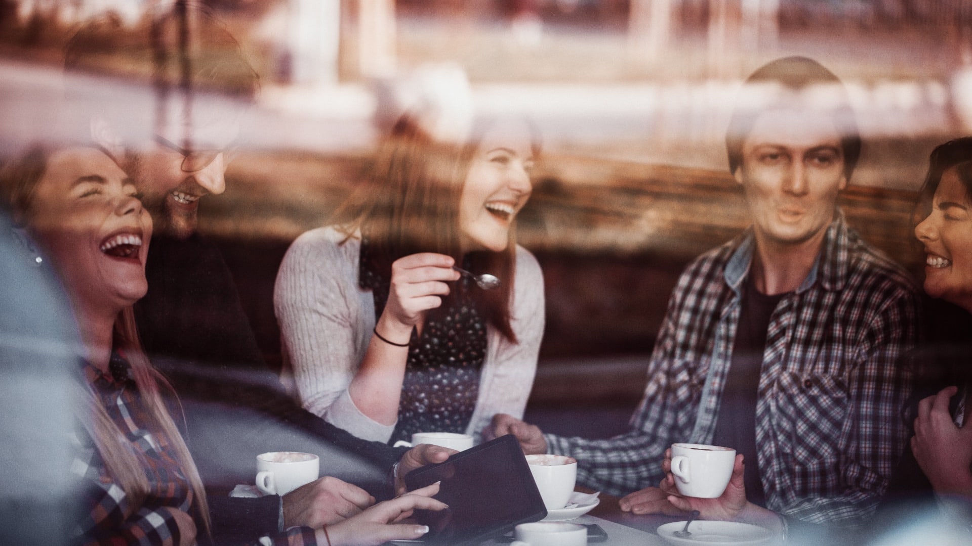 Friends In Cafe Drinking Coffee